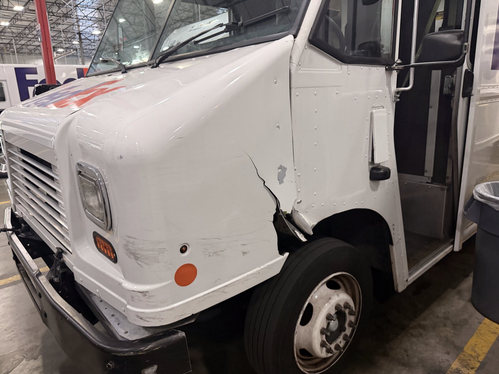 Delivery truck collision repair in progress